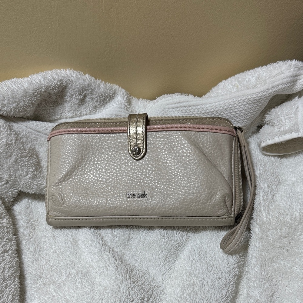 The Sak Taupe Wristlet with Metallic Accent